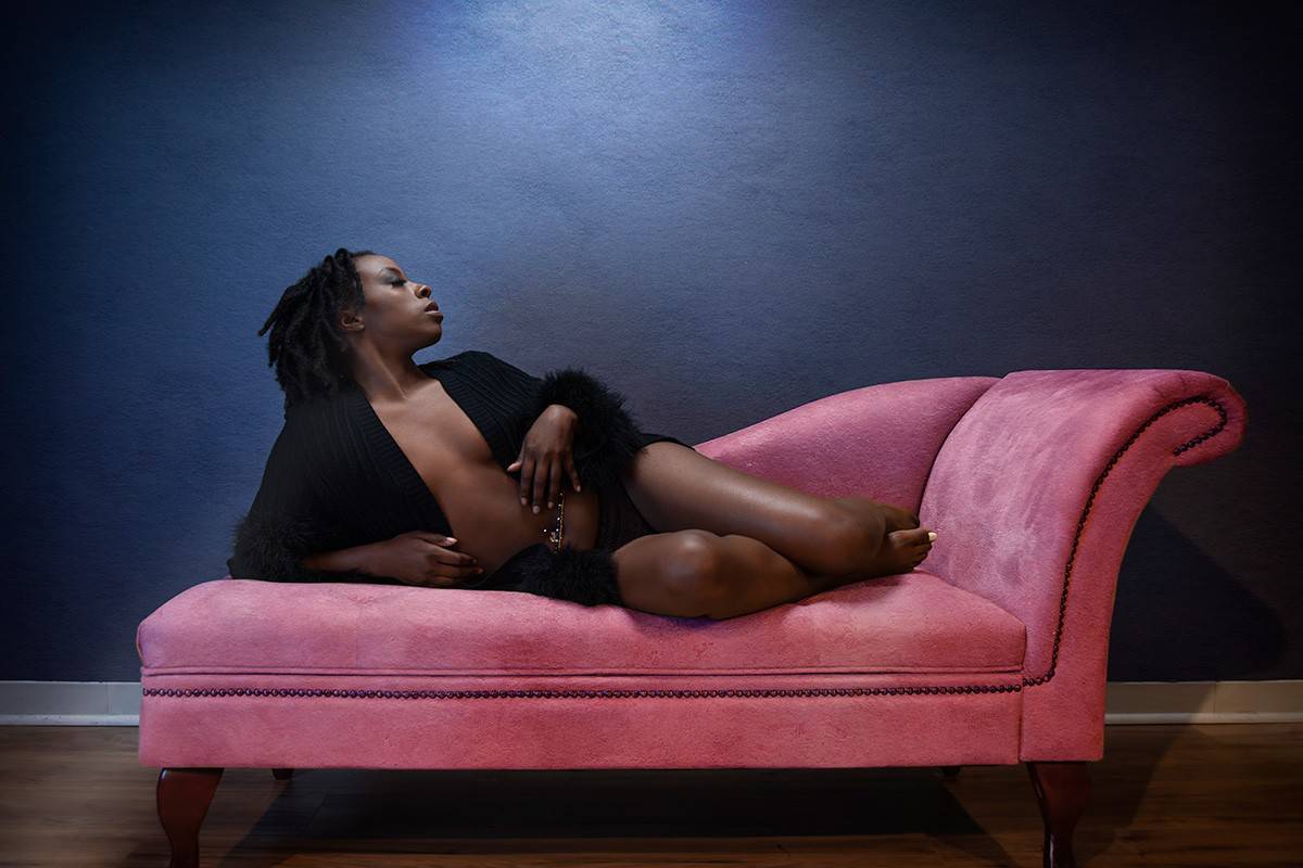 Boudoir pose on chaise lounge