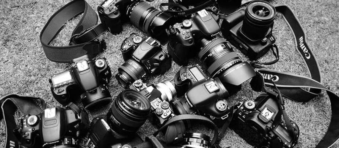 A slew of DSLR cameras on the ground