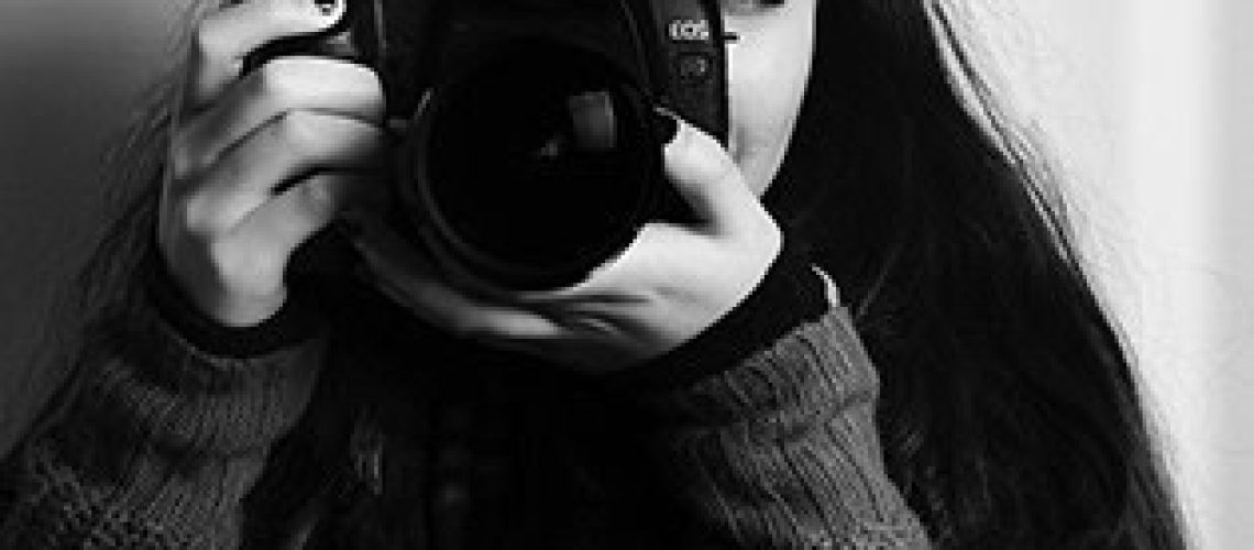 Female photographer in black & white